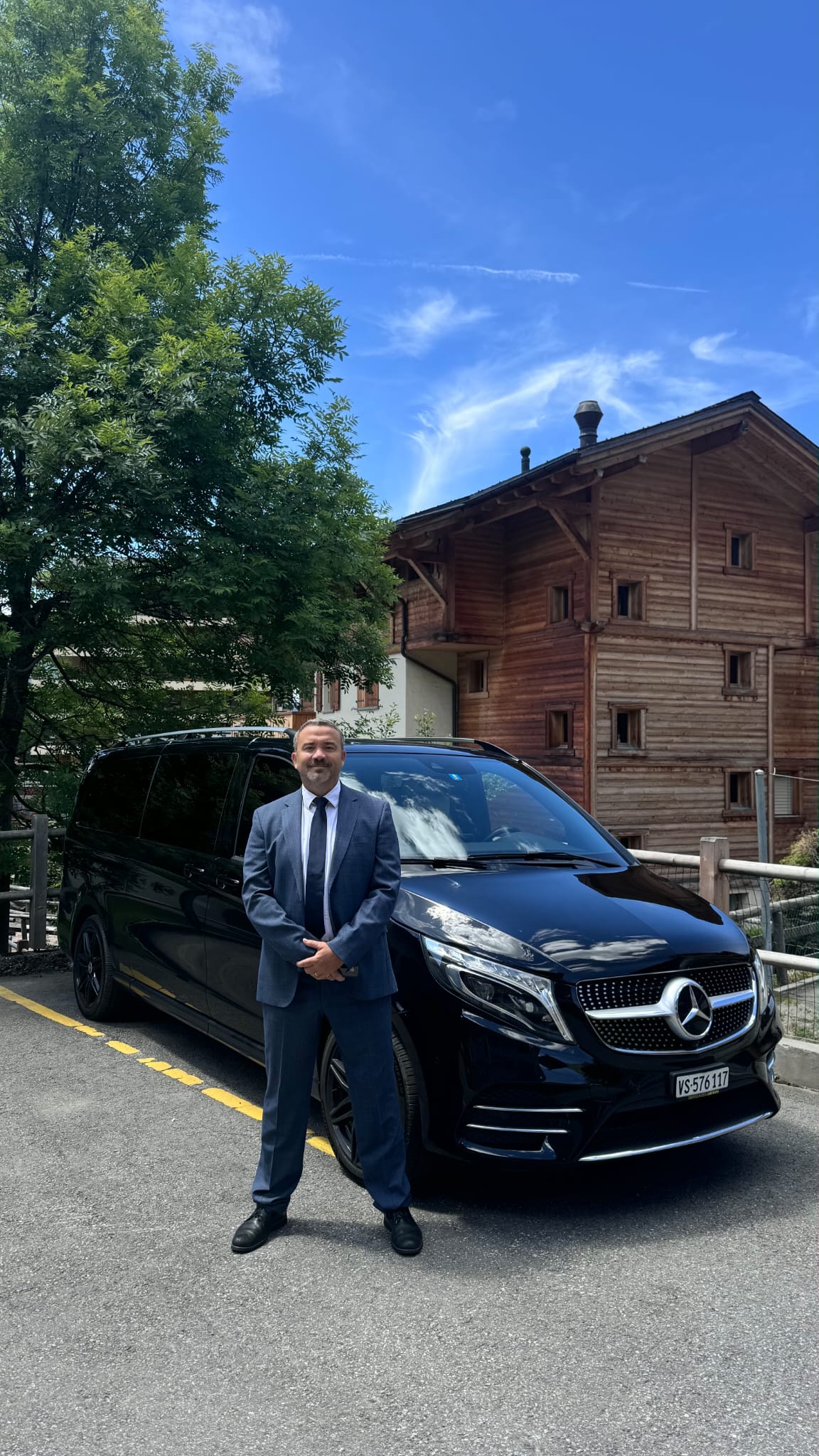 Private chauffeur arrival at an alpine hotel in Switzerland